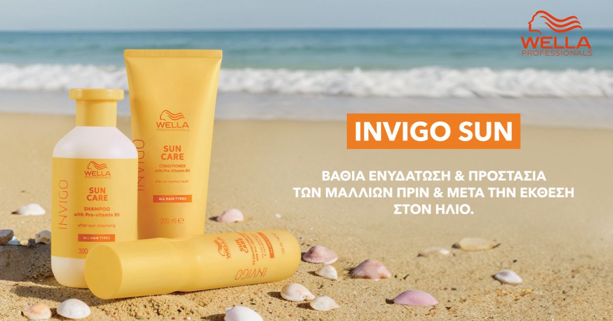 Three yellow Wella Invigo Sun Care bottles on a sandy beach with the sea in the background and an orange INVIGO SUN label on the right.