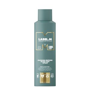 Bottle of LABEL.M Fashion Edition Blow Out Spray, teal container with gold accents and white text.
