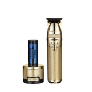 Babyliss Pro FX799GE FXONE Skeleton Trimmer σε χρυσό χρώμα με βάση φόρτισης.