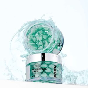VT Cosmetics PDRN Capsule Cream 50ml με υδάτινο φόντο και κάψουλες.