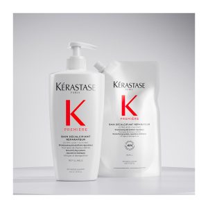 Two white Kerastase K Première hair care containers—a pump bottle and a refill pouch—with bold red 'K' logo on a light background.