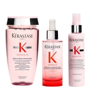 Three pink Kérastase Genesis hair care bottles (shampoo, serum, leave‑in) arranged side by side against a white background in a product photo.