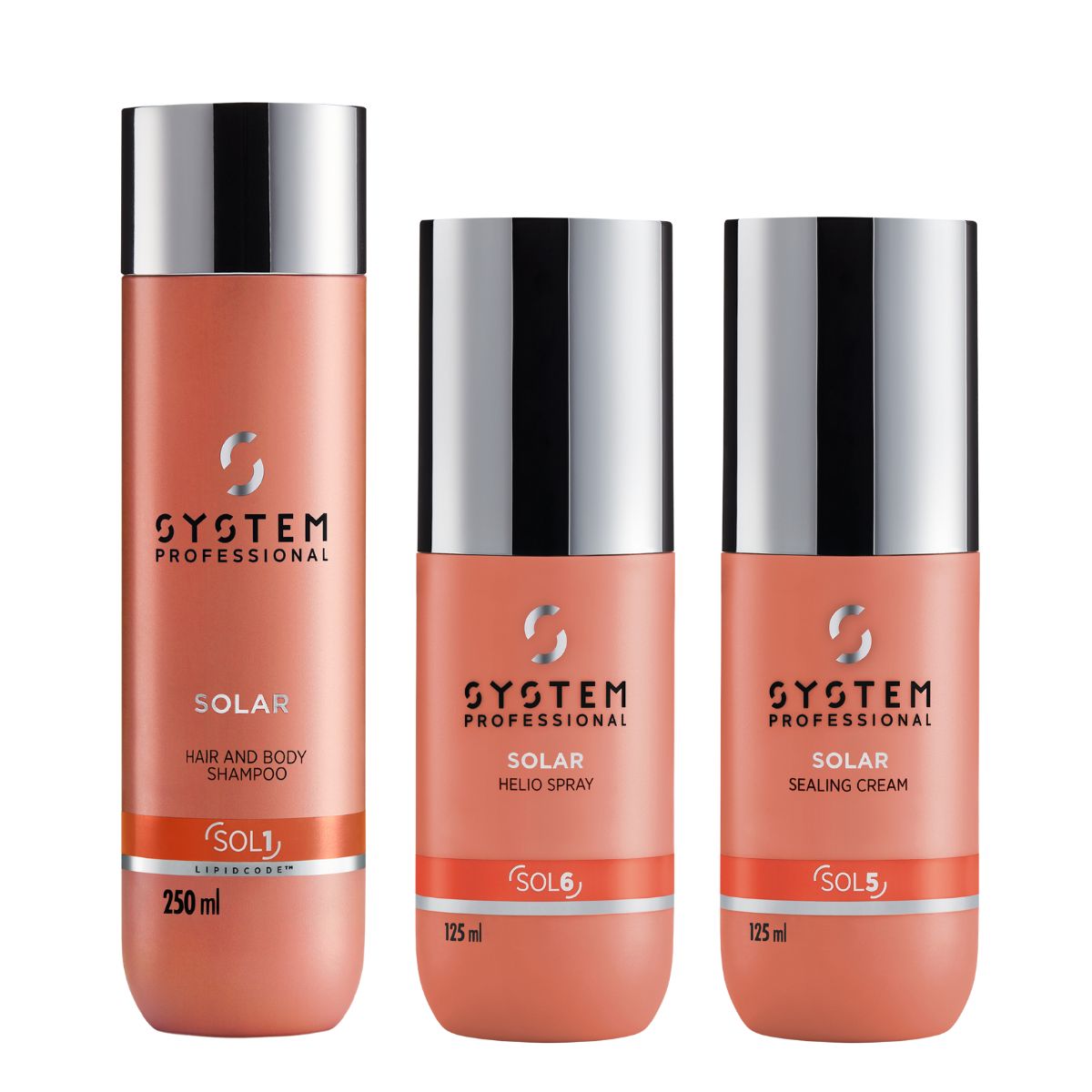 System Professional Solar Set (Hair & Body Shampoo 250ml, Sealing Cream 125ml, Helio Spray 125ml) Three System Professional Solar hair care bottles: shampoo, spray, and sealing cream in coral-pink bottles with silver caps (left to right).