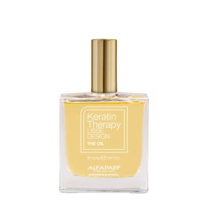 Clear square perfume bottle with a gold cap containing yellow oil; label reads Keratin Therapy Lisse Design The Oil by Alfaparf Milano.